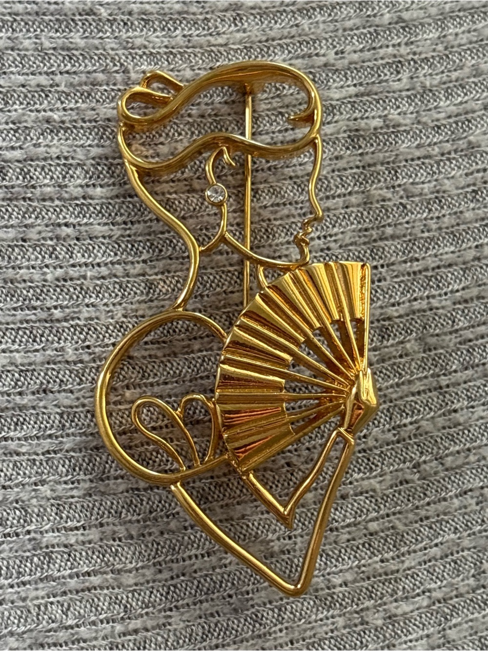 Vintage Lady Remington marked gold tone woman holding fan brooch